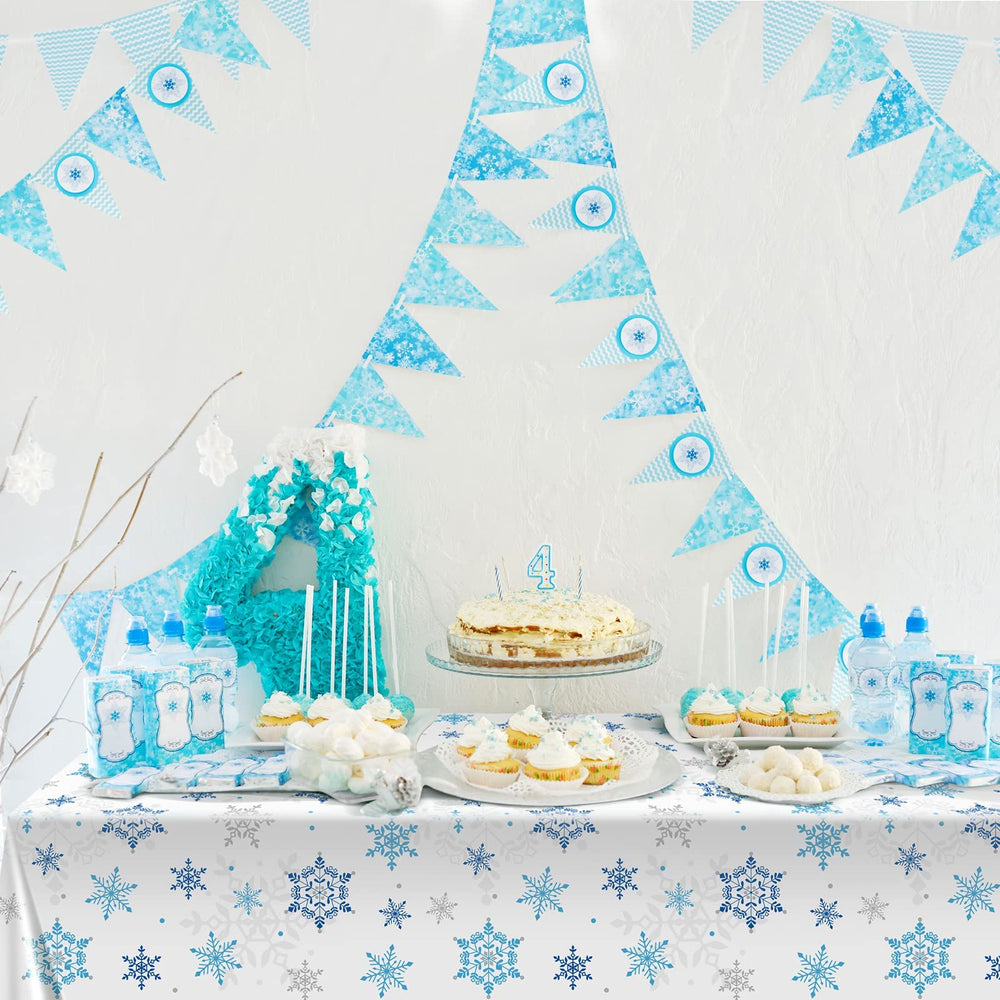 Tatuo large 8-foot tablecloth framed by blue snowflakes for gatherings.