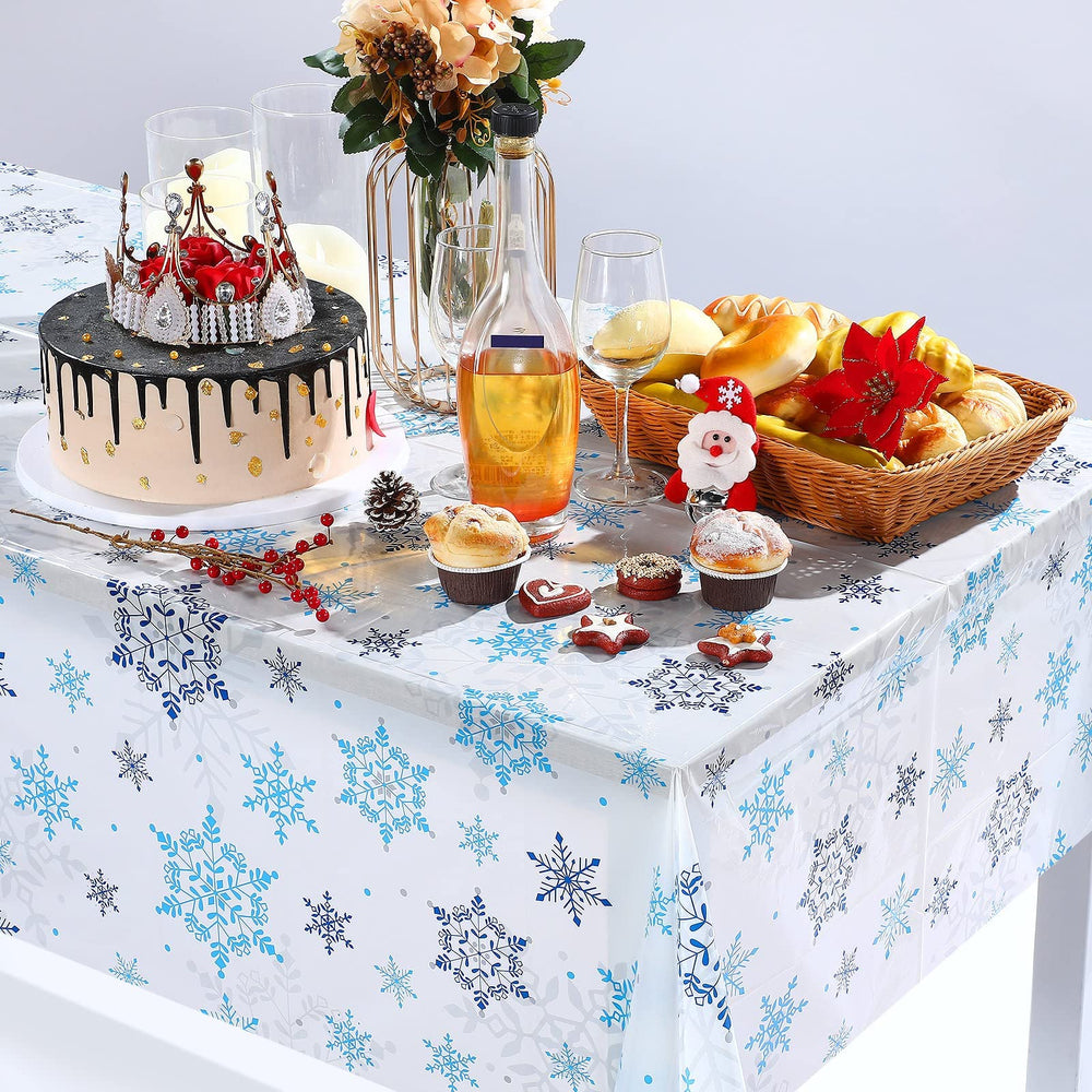 Tatuo snowflake backdrop decor draped on wall for photos.