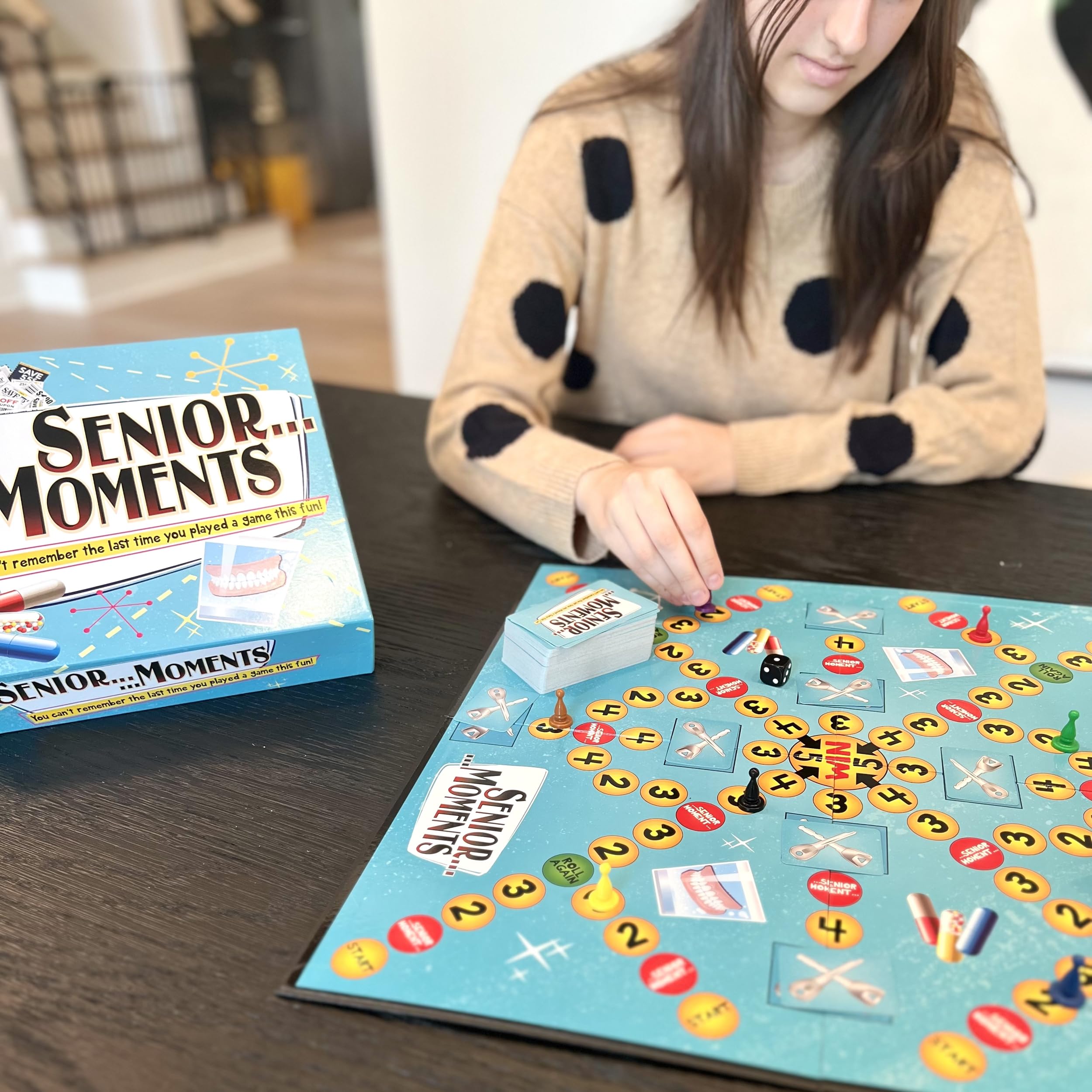 Closeup of Senior Moments card art with playful prompts for group play
