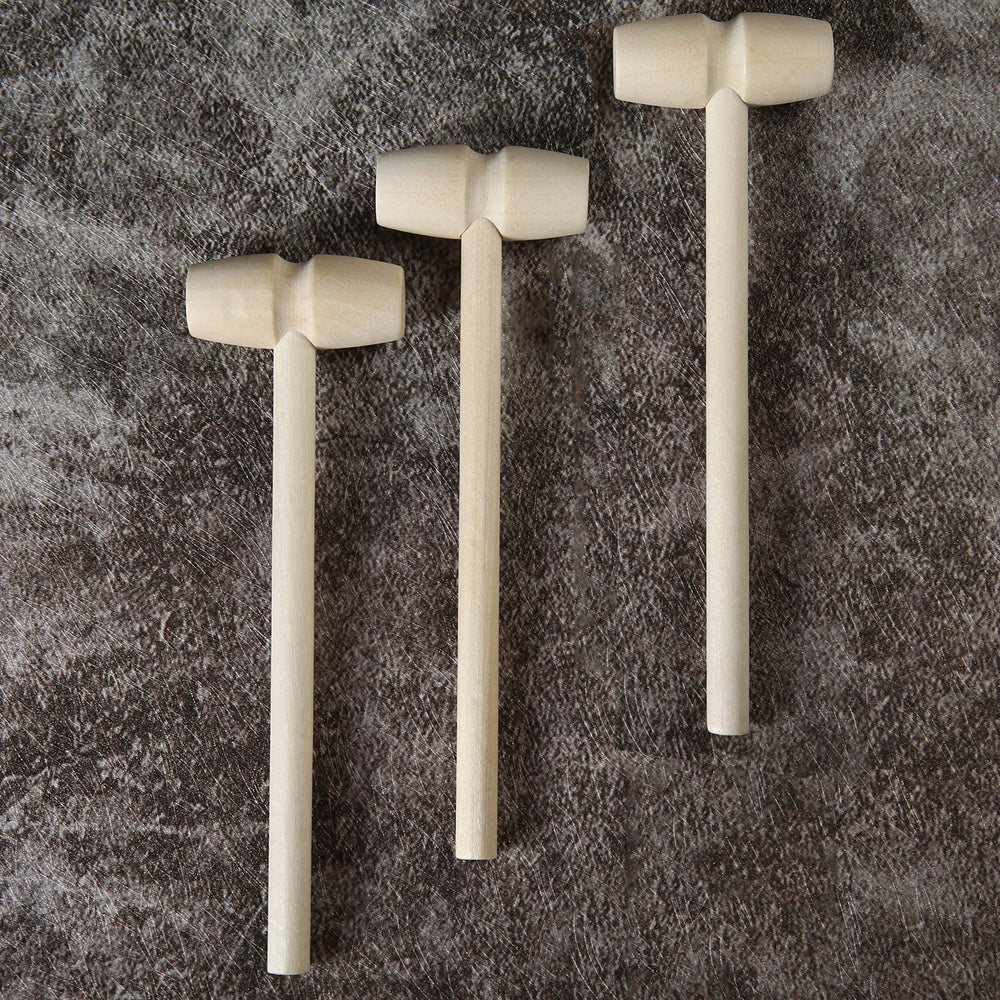 TDOCK wooden hammers shown with breakable chocolate gifts