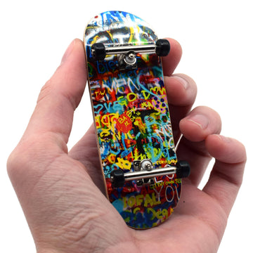 Teak Tuning Graffiti Wall deck with bold art for street-style skating.
