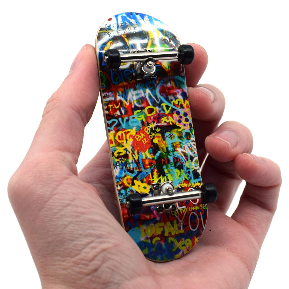 Teak Tuning Graffiti Wall deck with bold art for street-style skating.