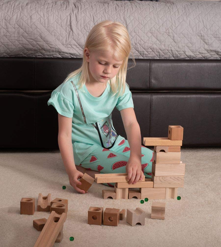 TEDCO kid enjoys free form play with blocks and marbles