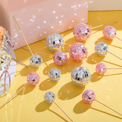 Teenyyou retro disco-ball topper reflects light for dramatic party ambiance.