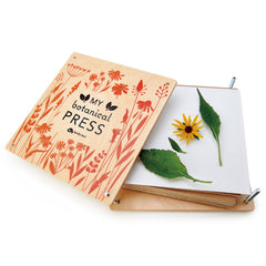 Tender Leaf Toys My Botanical Press open lid with flowers enables quick pressing.
