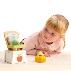 Tender Leaf Toys retro design market scale featuring wooden lever in action.
