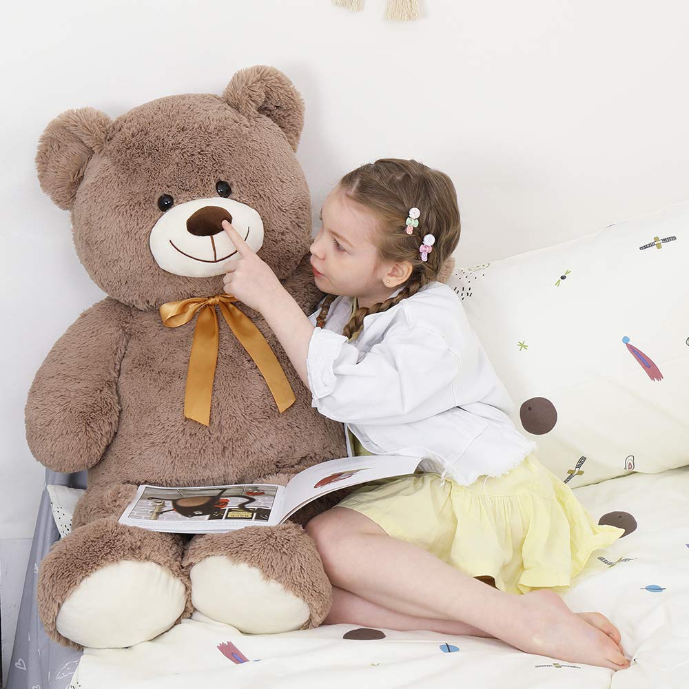 Tezituor bear used as bedroom decor in a cozy setting.