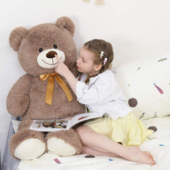 Tezituor bear used as bedroom decor in a cozy setting.