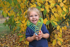 Kids enjoy the vibrant, bouncy motion of The Dreidel Company coil spring during playtime.