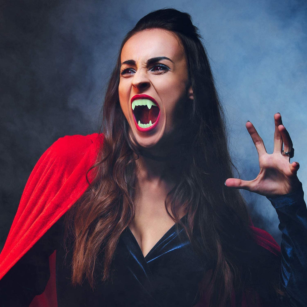 The Dreidel Company Neon Fangs Teeth pack 2 displayed for party pranks