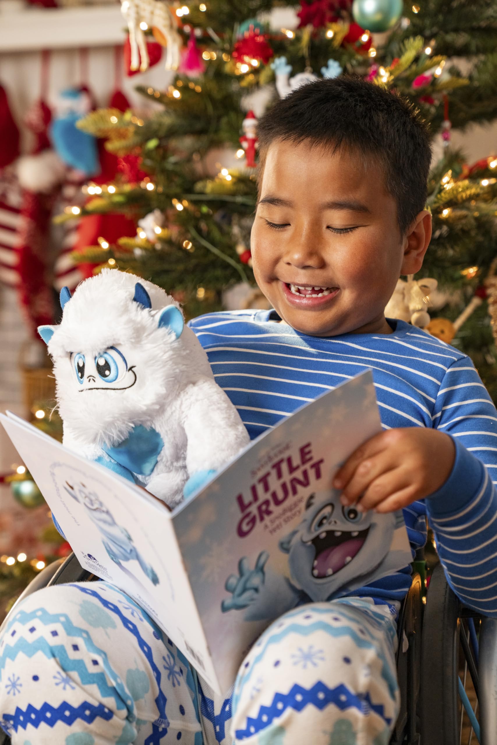 Close-up of The Elf on the Shelf Little Grunt plush showing holographic heart detail