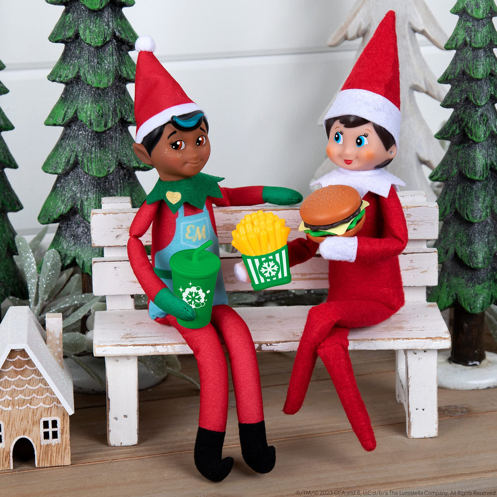 The Elf on the Shelf Polar Props baking tray with cupcakes brightens holiday displays.