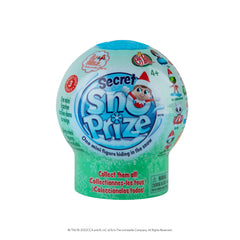 The Elf on the Shelf Secret SnoPrize unboxing moment with the globe and snow