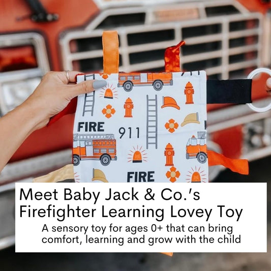 The Learning Lovey fire lovey attached to a stroller clip for on-the-go sensory play