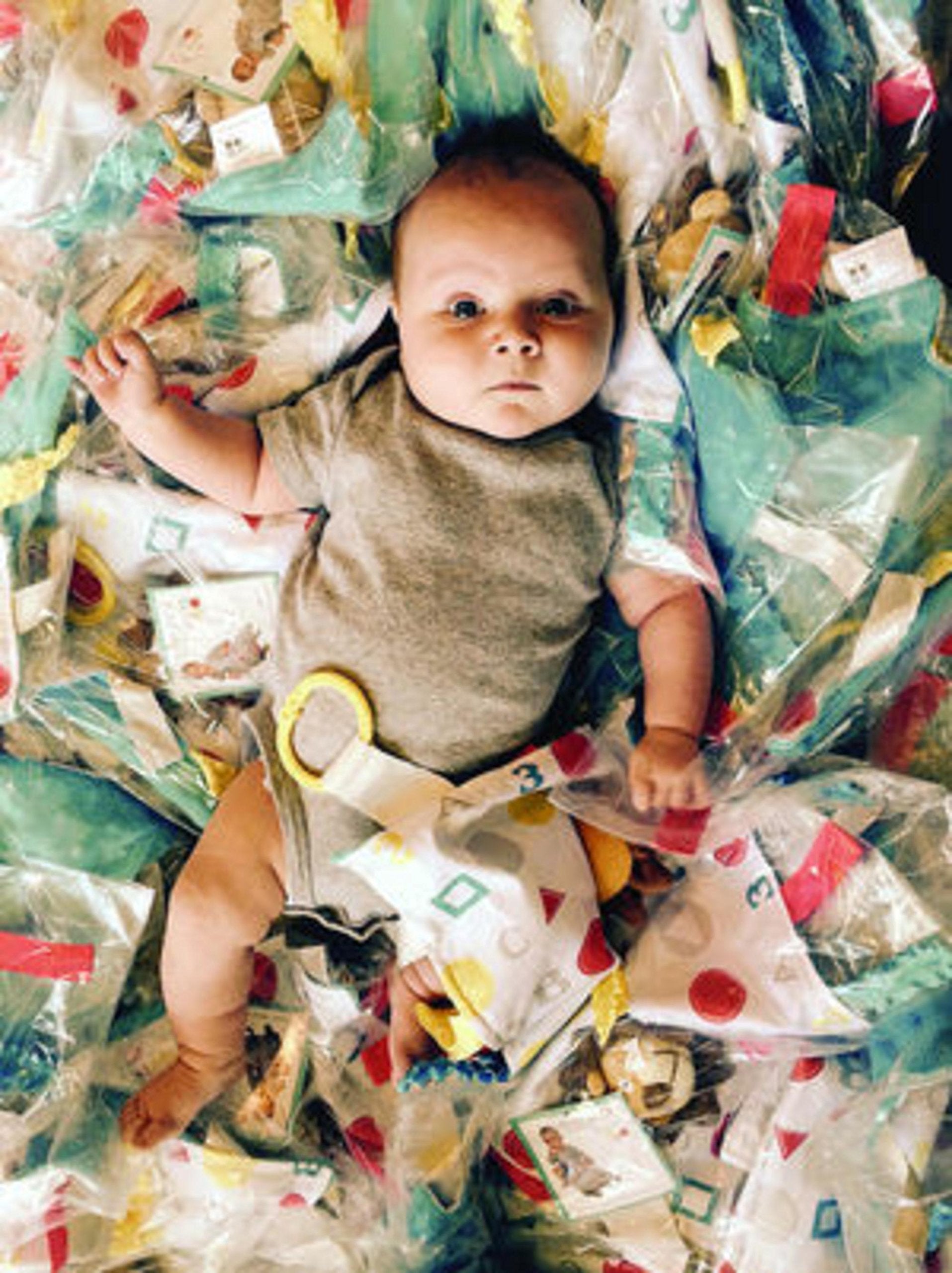 The Learning Lovey firefighter teether-link clip offers easy stroller or car seat access.