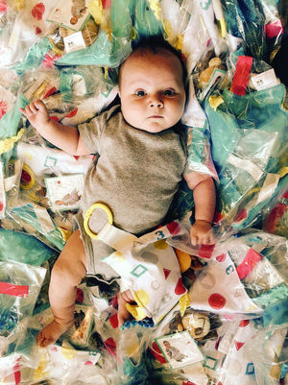 The Learning Lovey firefighter teether-link clip offers easy stroller or car seat access.