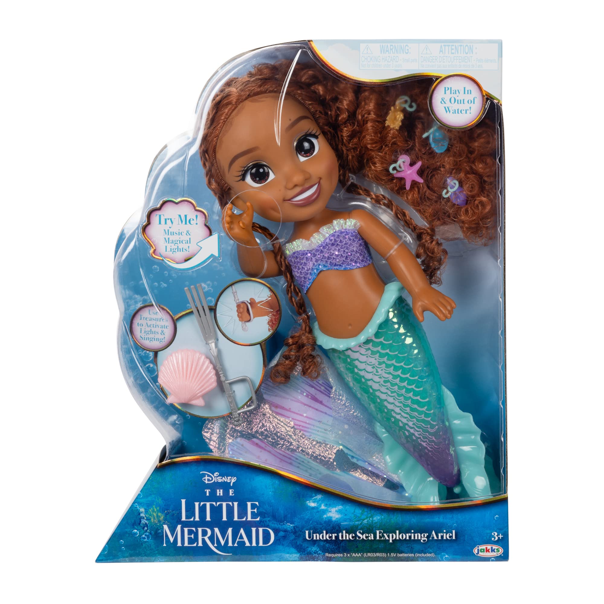 Ariel tail fins flow elegantly as she swims in water play.