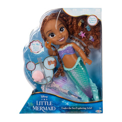 Ariel tail fins flow elegantly as she swims in water play.