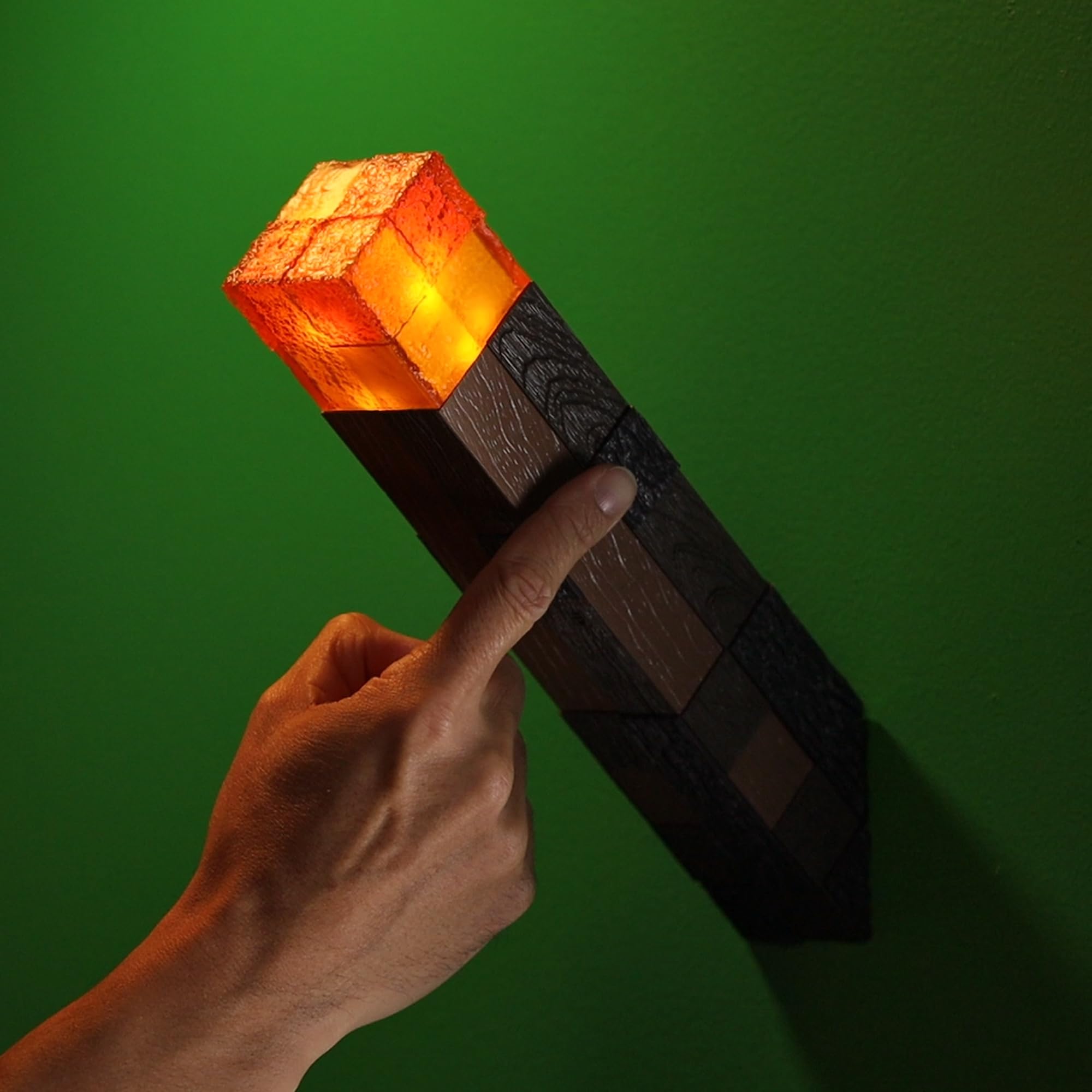 The Noble Collection Minecraft Torch Illuminating Collector battery compartment accessible for simple replacement.