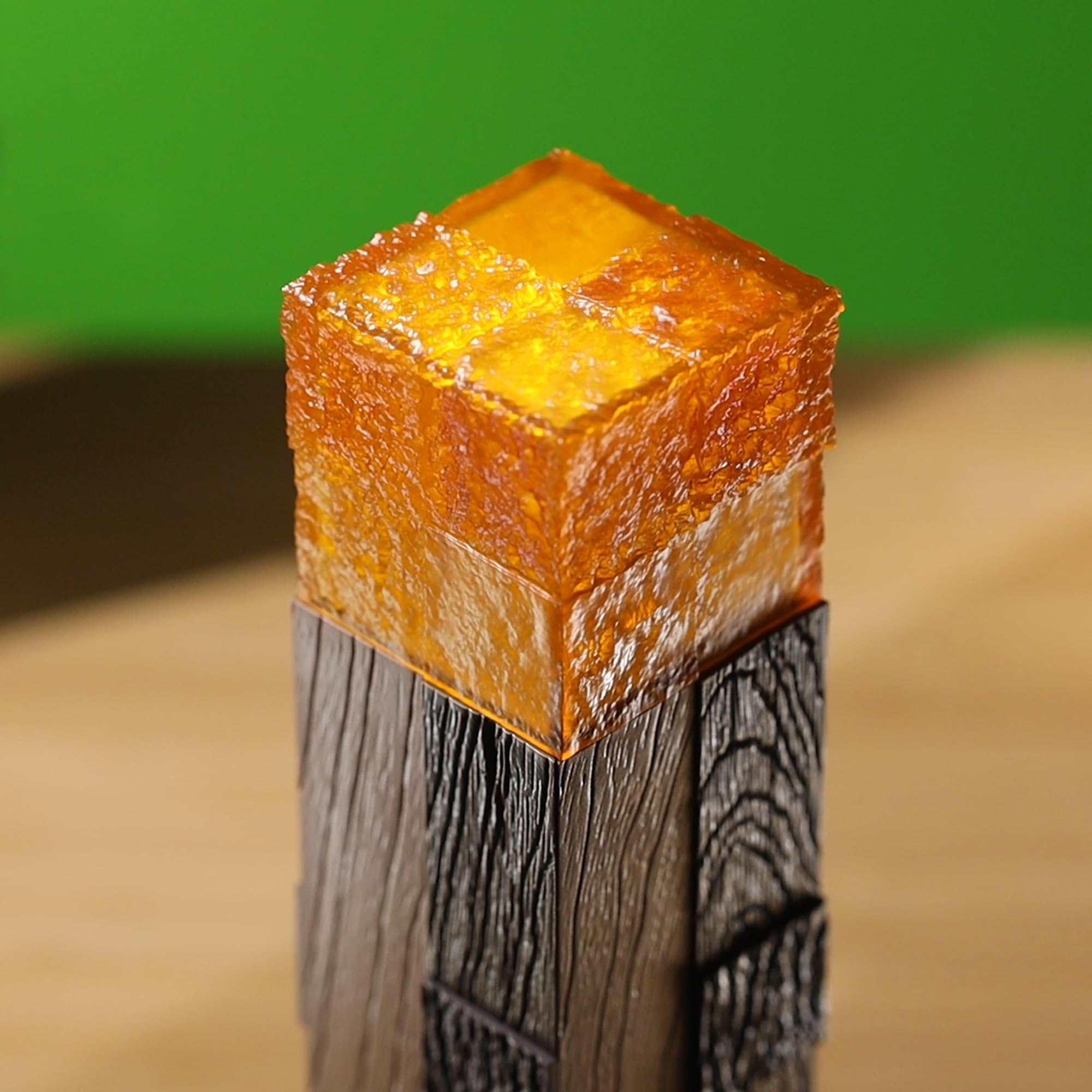 The Noble Collection Minecraft Torch Illuminating Collector on desk creates a cozy, Minecraft-inspired workspace.