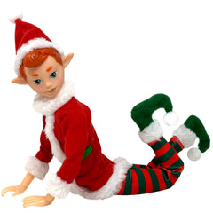 The Original Elf 12-inch doll posed on a shelf, perfect festive decor.