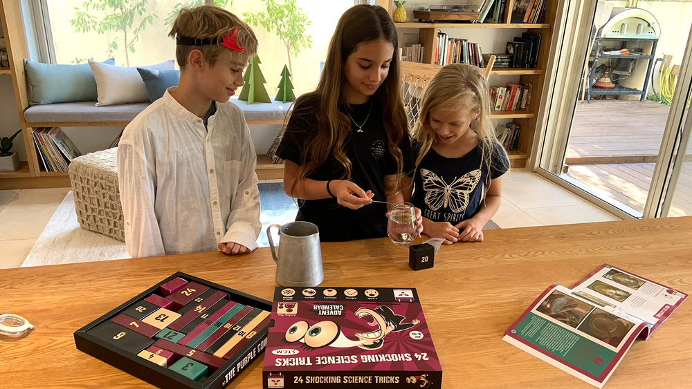 Kids playing with The Purple Cow Advent Calendar for family learning and fun.