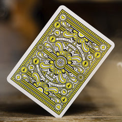 theory11 Beatles Green Deck foiled accents catch light on table.