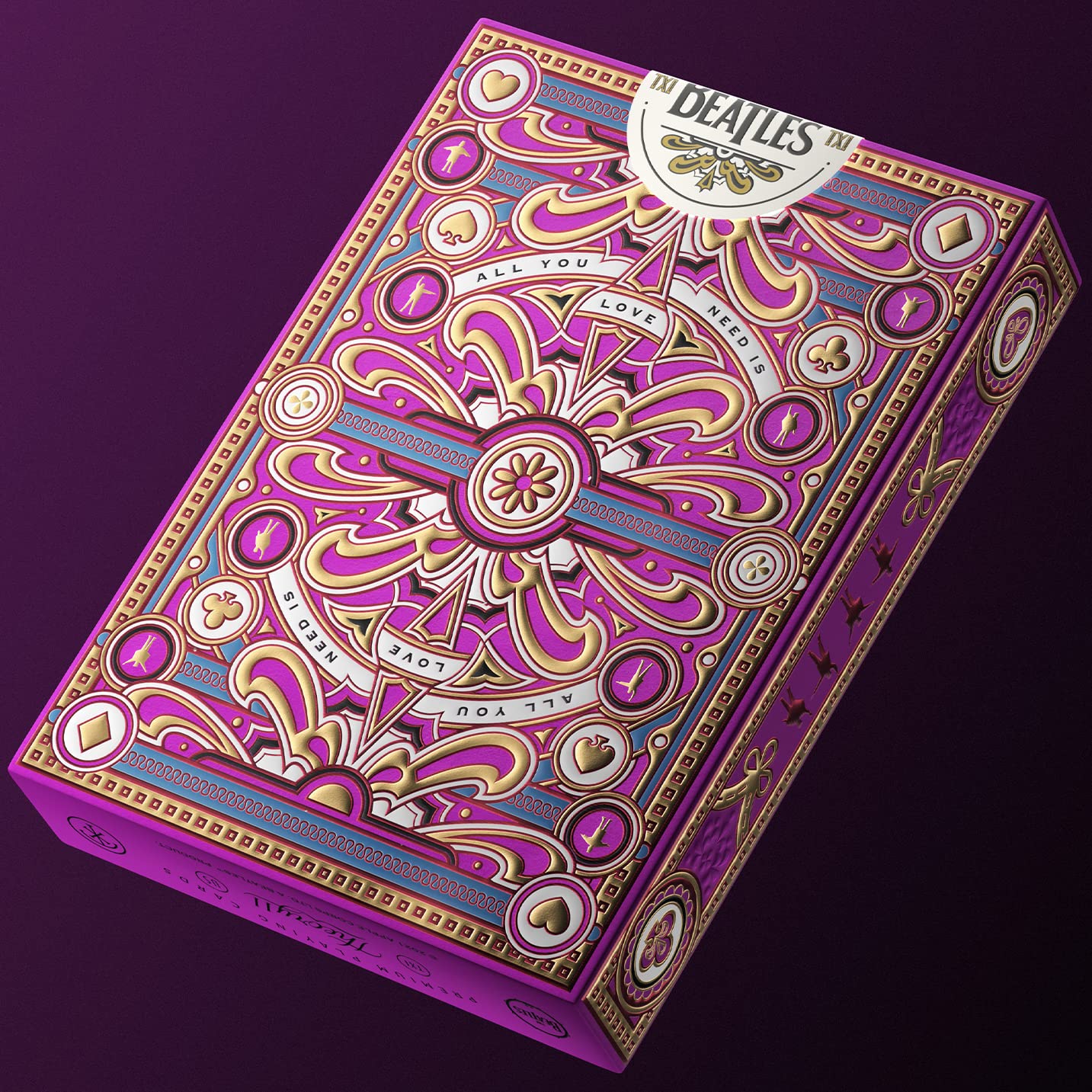theory11 The Beatles Pink Deck packaging features multi-level embossing with vibrant foil accents.