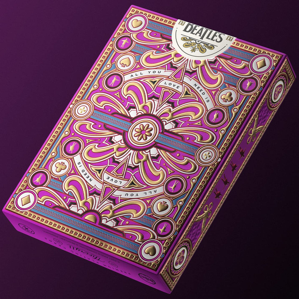 theory11 The Beatles Pink Deck packaging features multi-level embossing with vibrant foil accents.
