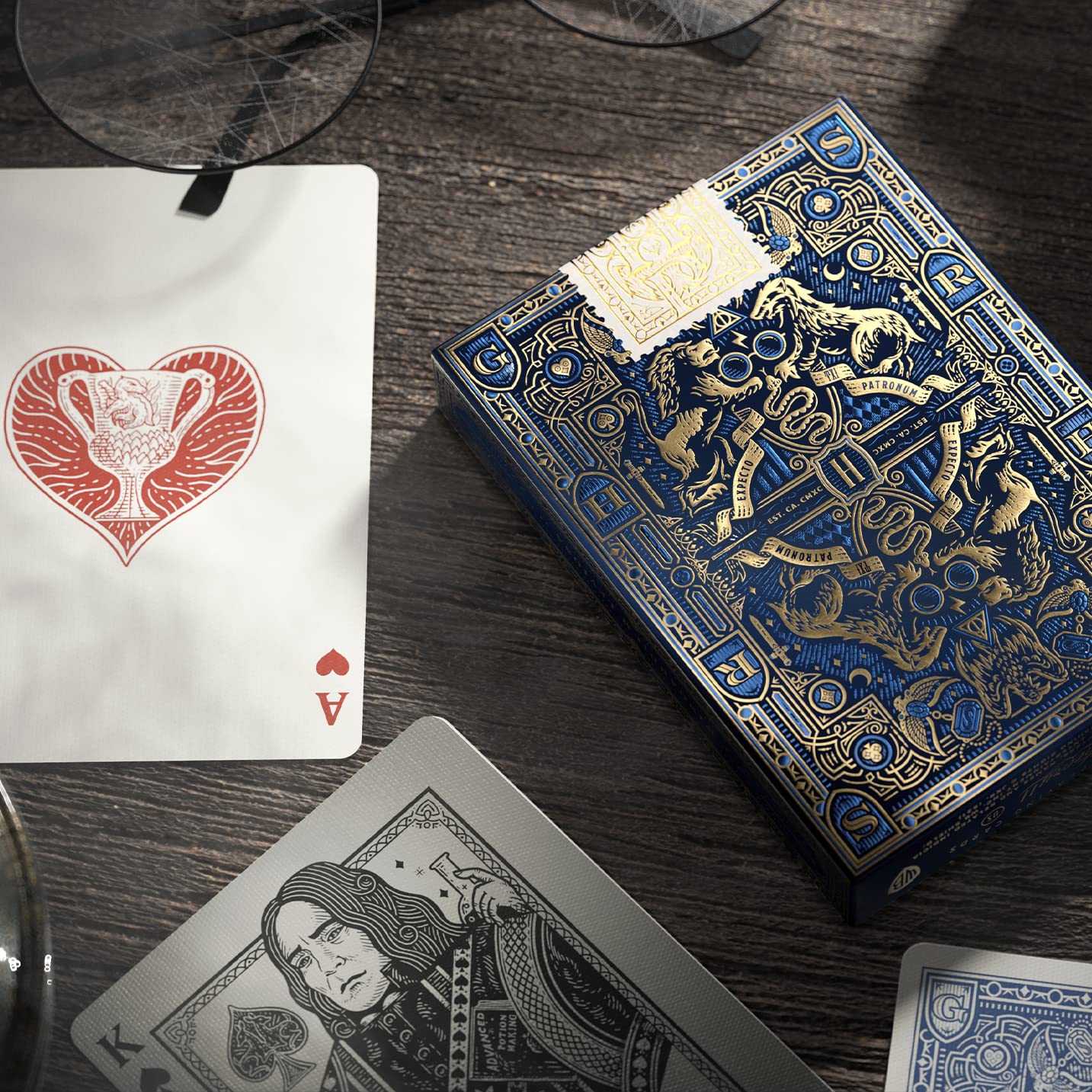 Theory11 Ravenclaw blue box with gold foil and embossing enhances display appeal.