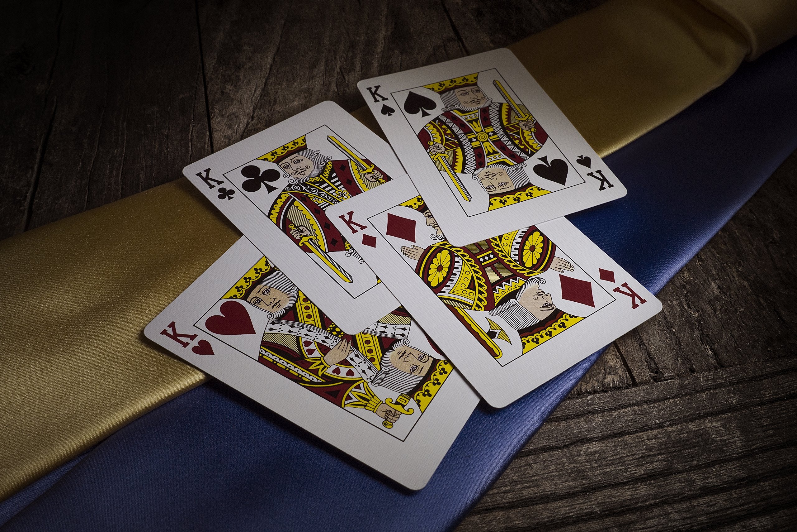 Theory11 Tycoon Blue deck in hand, showcasing smooth handling and performance-ready feel.