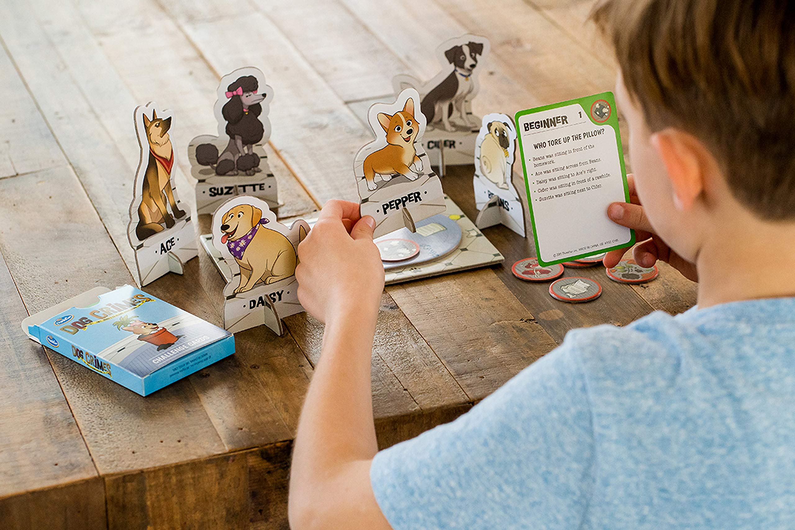 ThinkFun Dog Crimes challenge cards showing beginner to expert clues