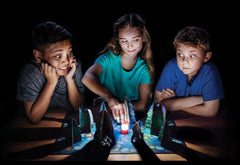 ThinkFun Shadows in the Forest lantern lights your way as seekers navigate the dark.