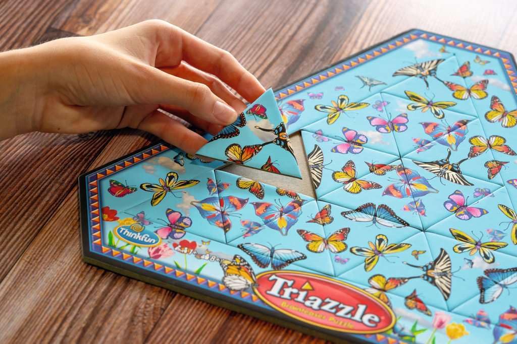 ThinkFun Triazzle Butterfly Edition puzzle frame in action encouraging strategic thinking.