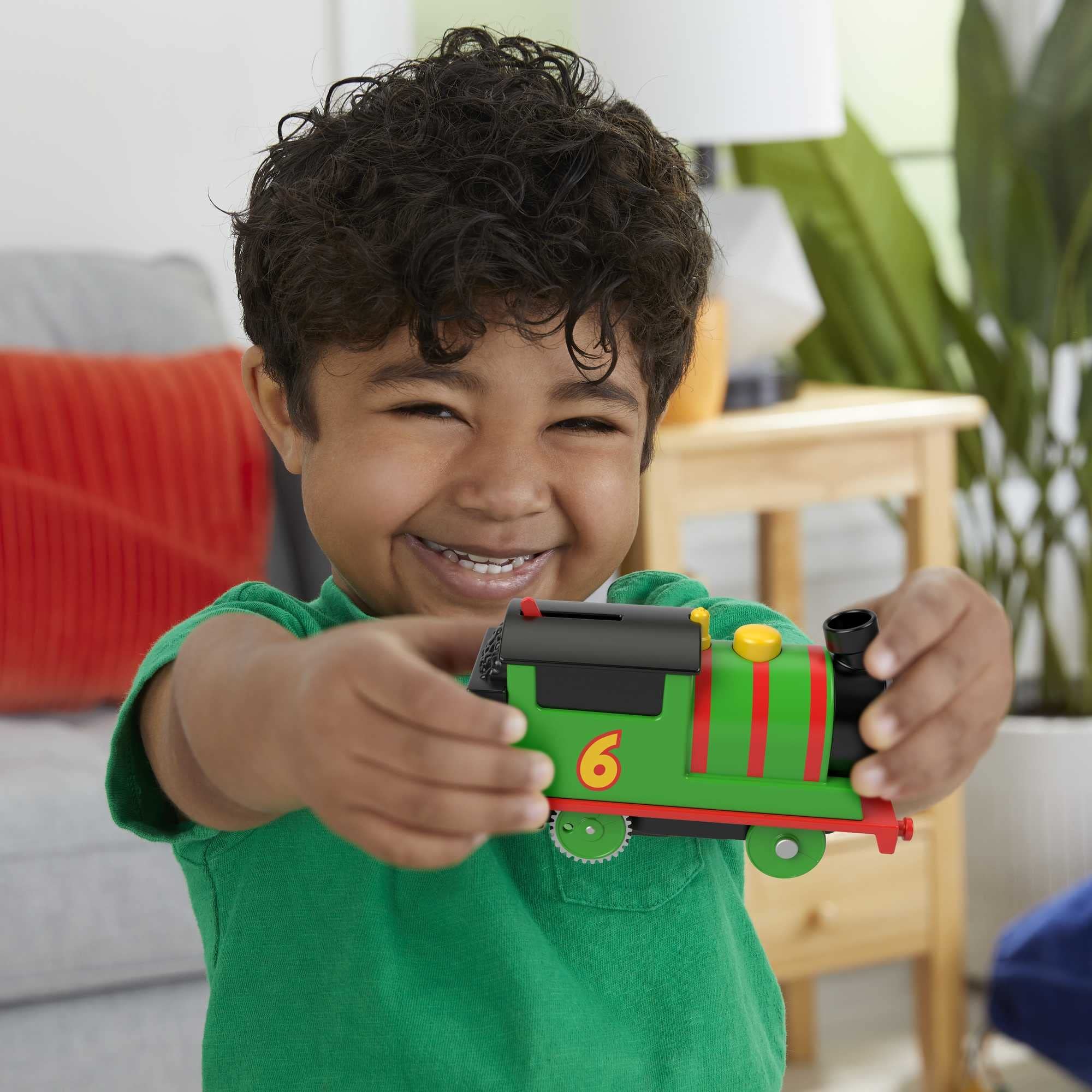 Thomas and Friends Percy motorized engine in action boosts dynamic play.
