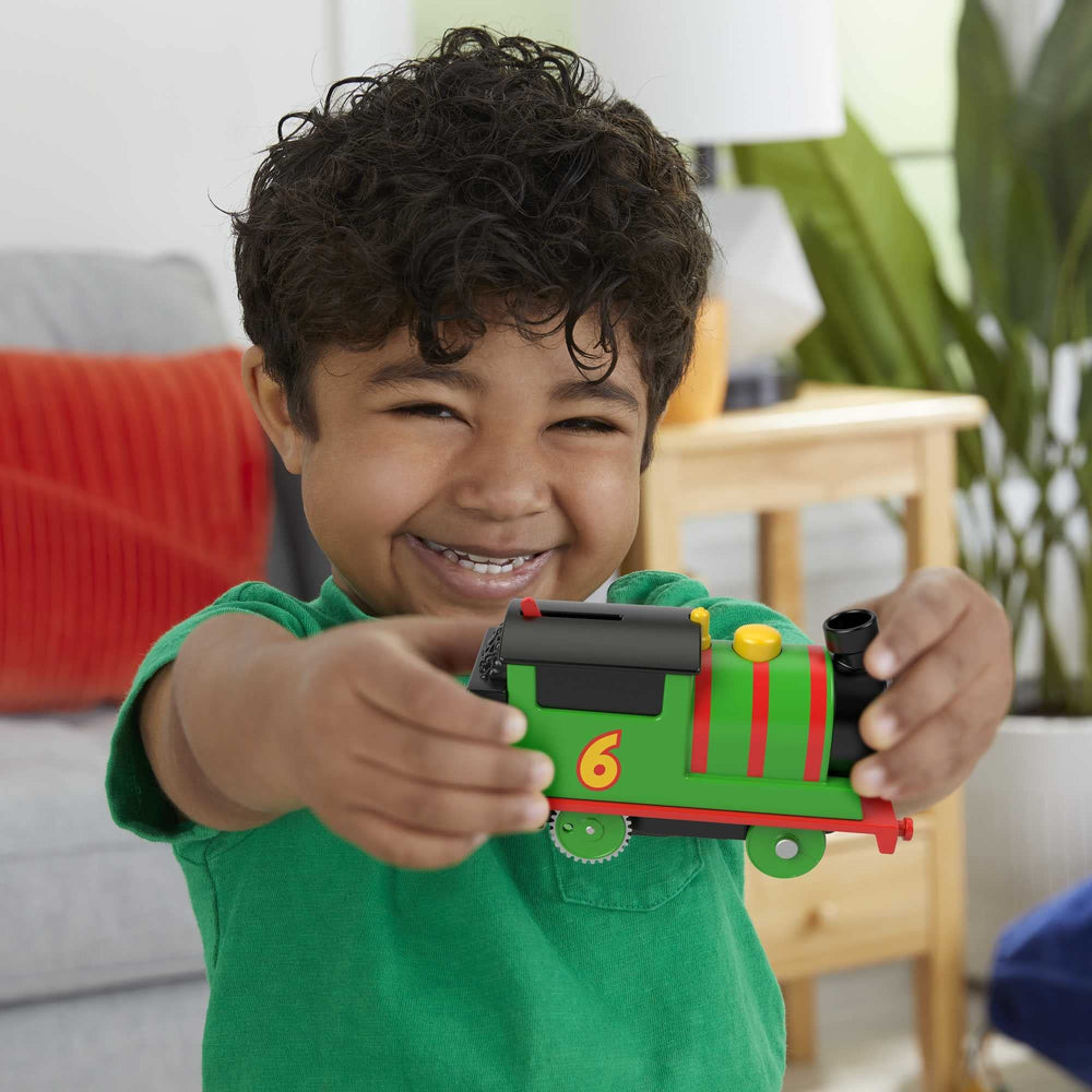 Thomas and Friends Percy motorized engine in action boosts dynamic play.