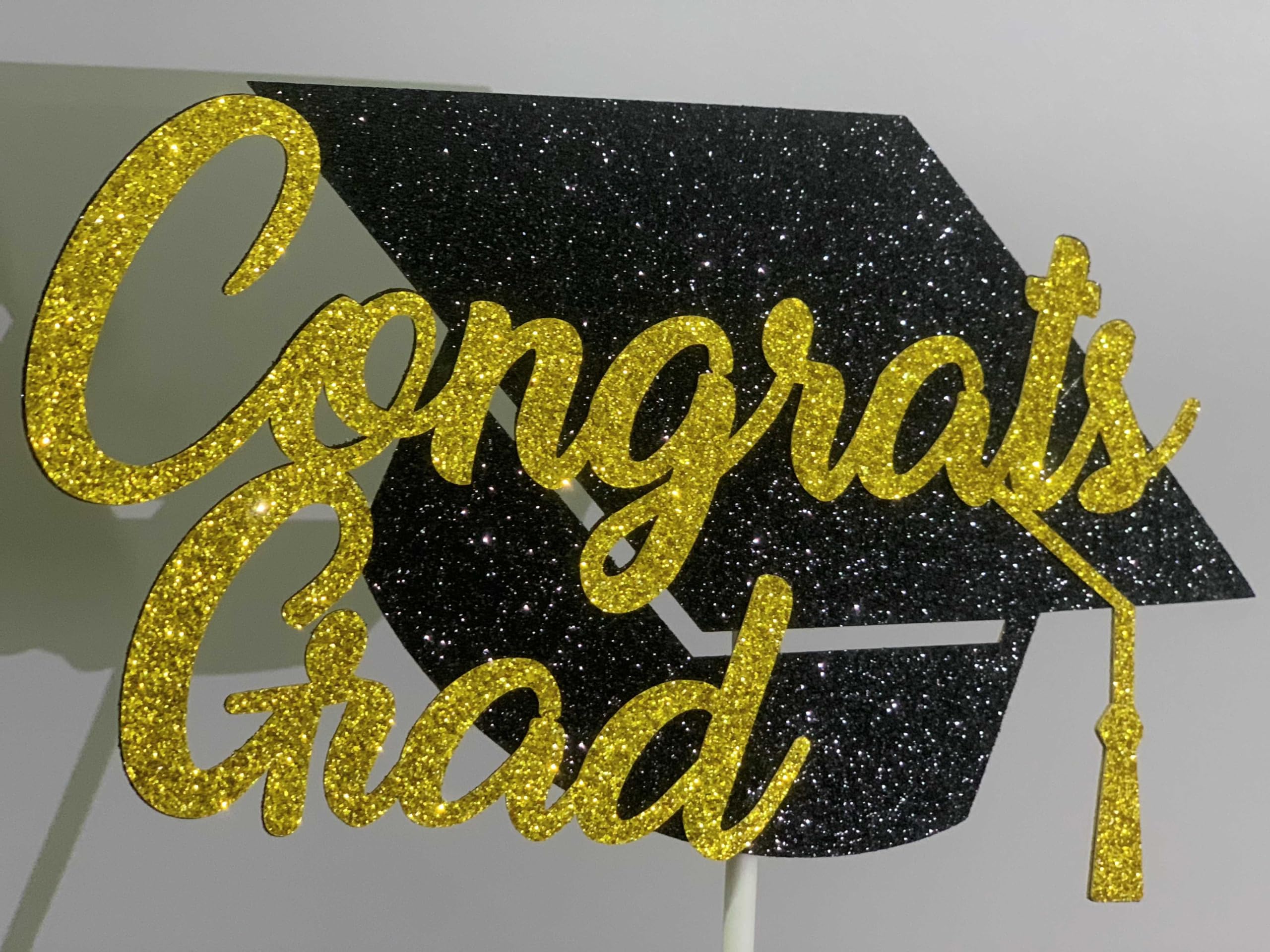 Tinbax Graduation cake topper glitter detail highlighting celebratory shine for photos.