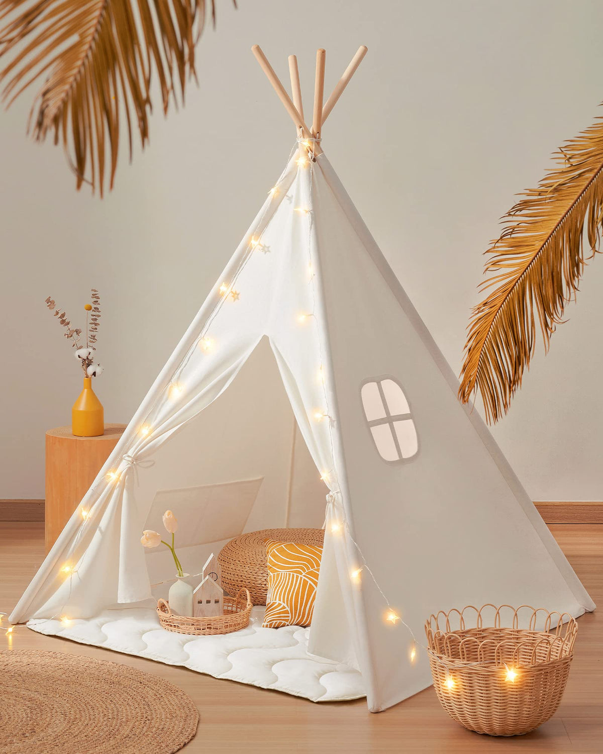 Tiny Land Teepee Tent in white cotton canvas creates a cozy play space for kids.