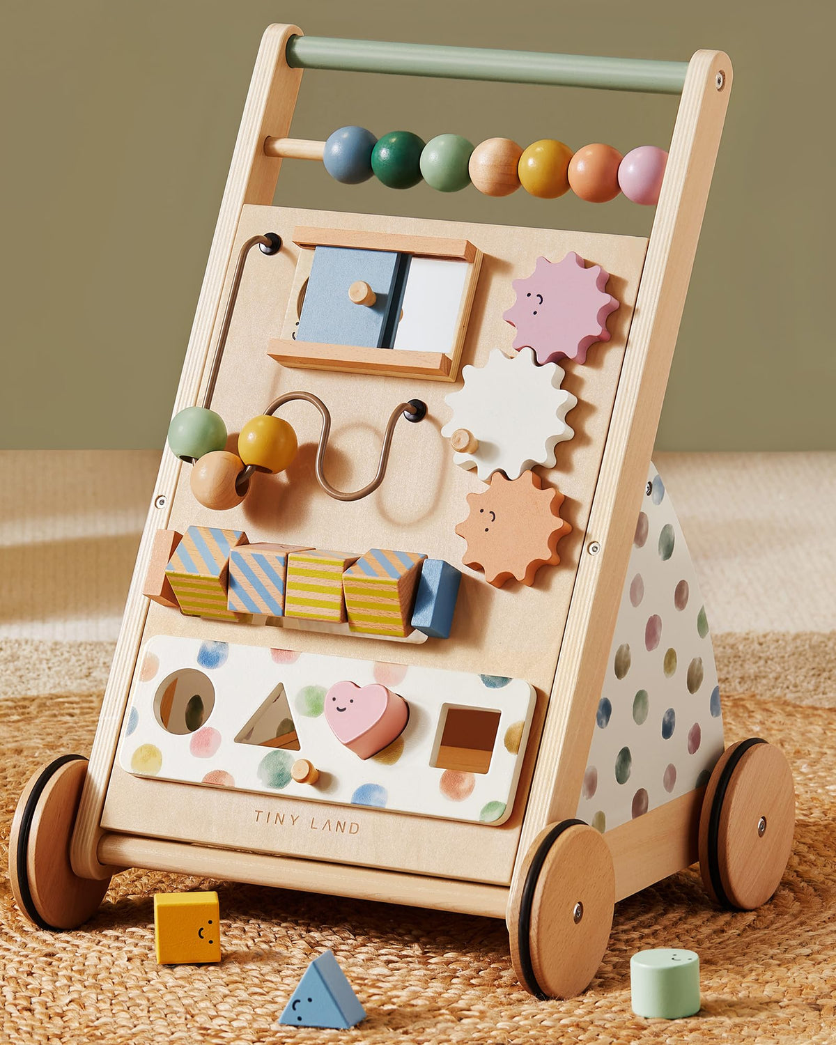 Tiny Land wooden baby walker with natural wood finish supports first steps.