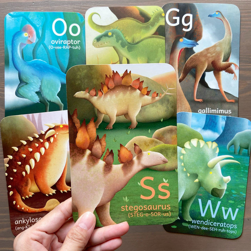 Tiny Worlds F Spinosaurus card offers playful learning prompts for letters.