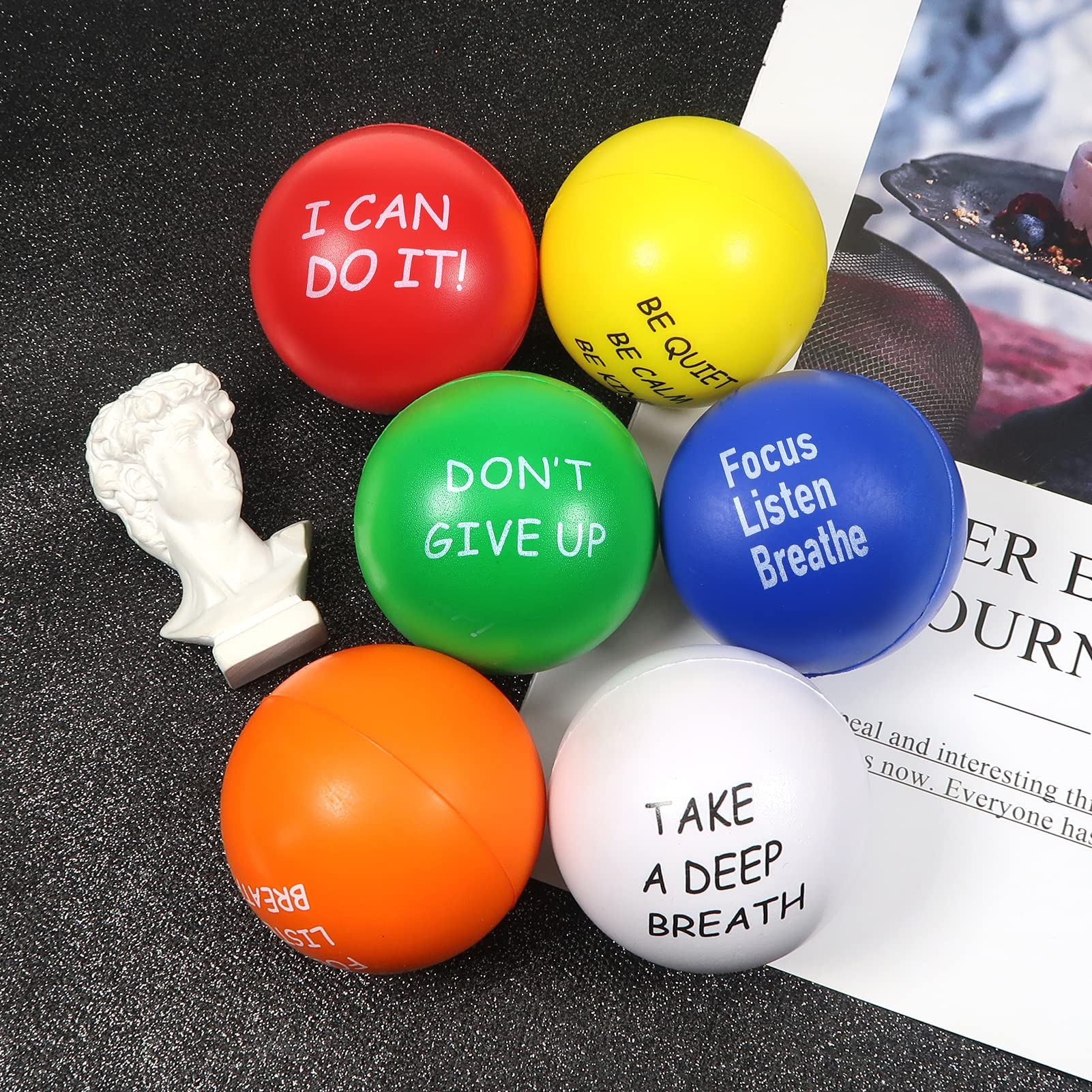 TOAOB white 2.5-inch stress ball for sensory play and relaxation.