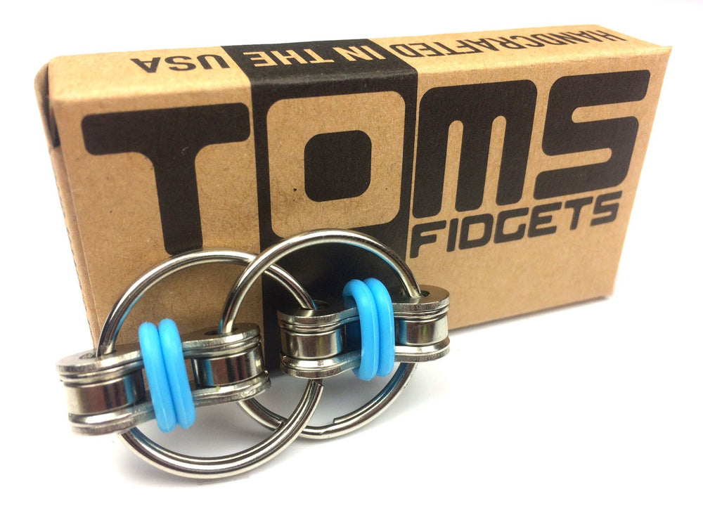 Tom's Fidgets blue chain fidget compact and portable for travel and classrooms.