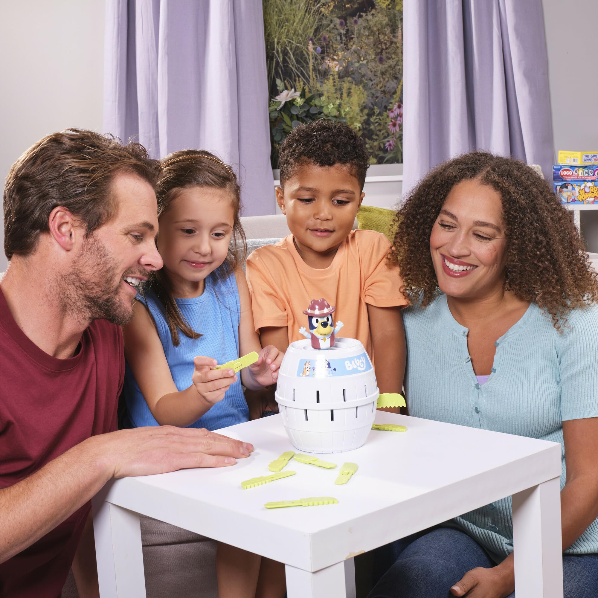 Family around a table enjoying quick, suspenseful rounds
