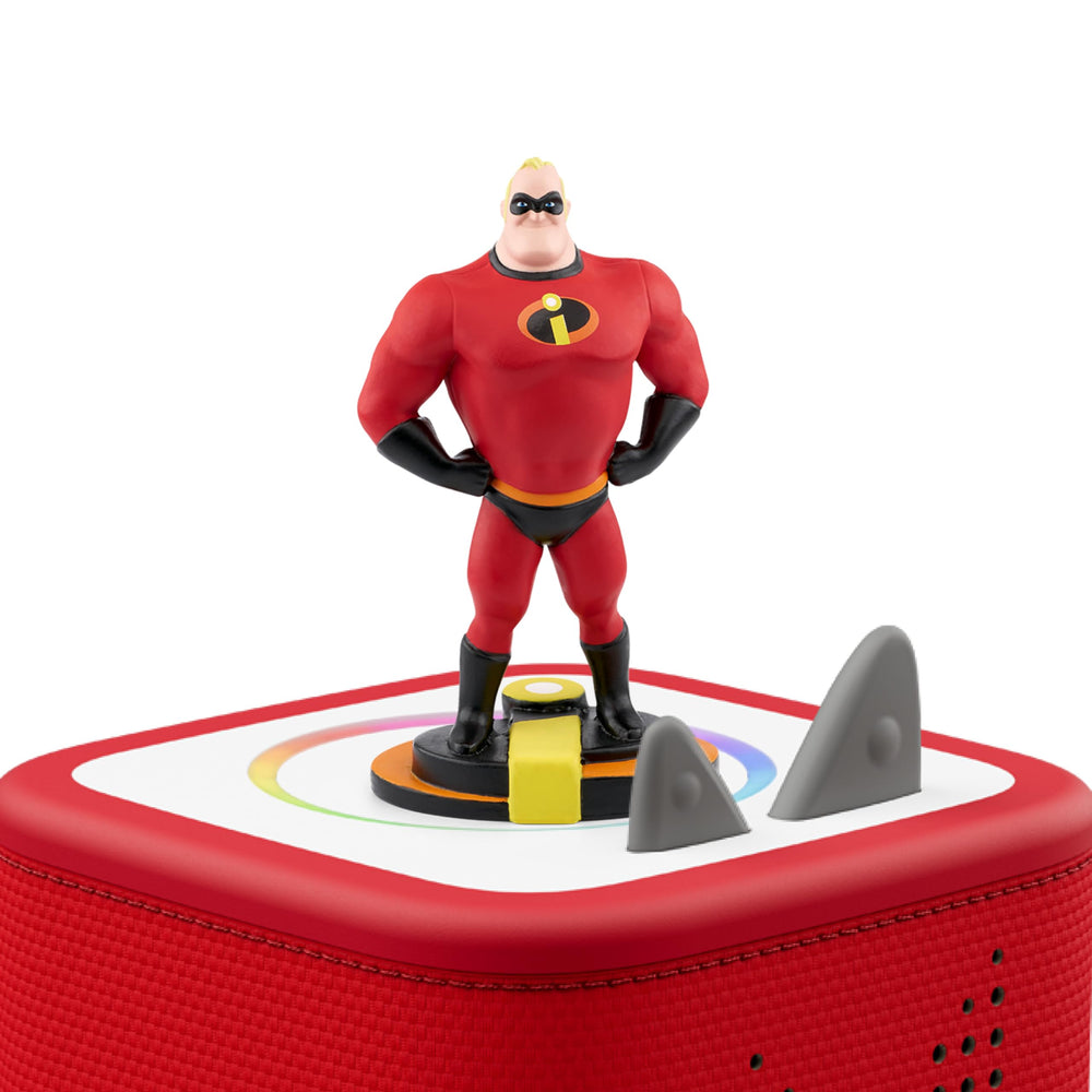 Mr. Incredible sits on a Toniebox for immersive listening.