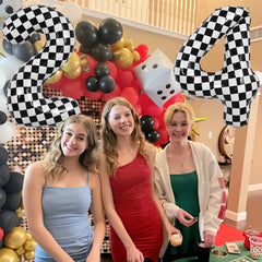 TONIFUL balloon arch and photo prop uses race theme effectively.
