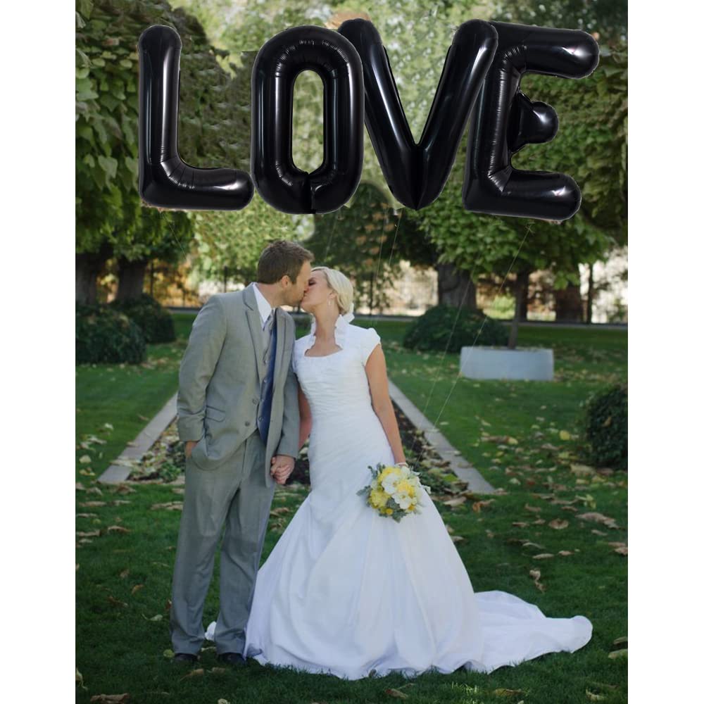 TONIFUL dramatic black L balloon backdrop ideal for photos.
