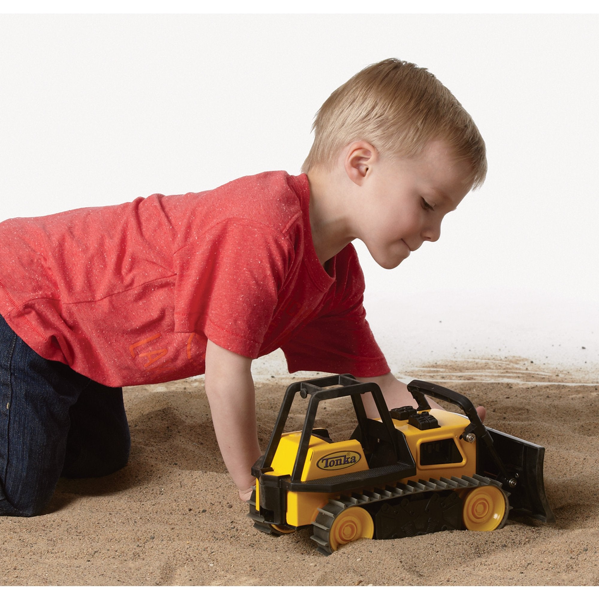 Tonka bulldozer dust-trail shot showcases blade motion during pretend work