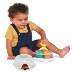 Toomies Dino shells in bright colors help toddlers practice matching during pretend play.