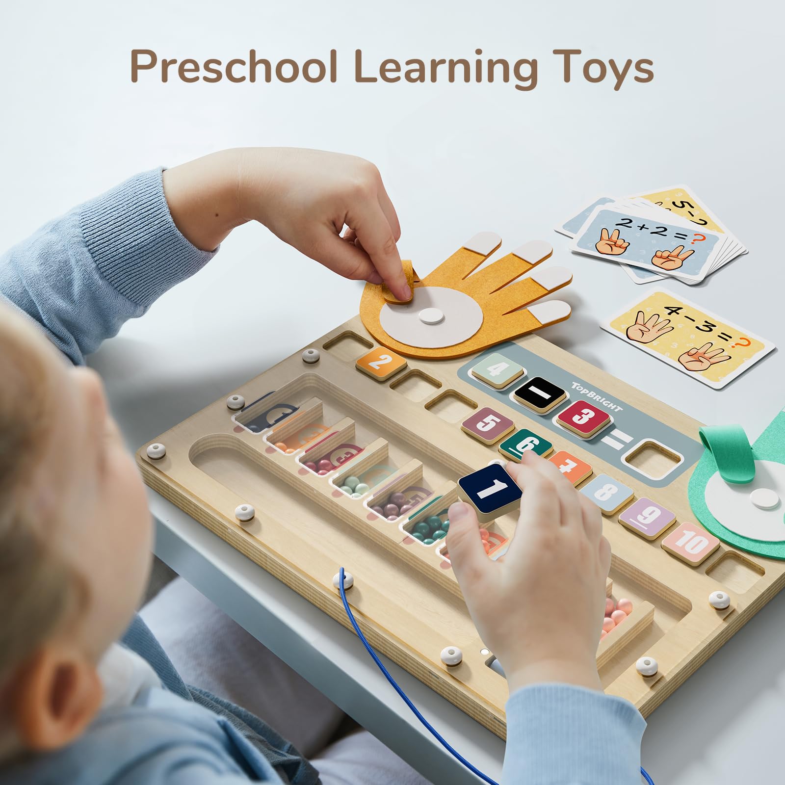 Top Bright wooden beads securely housed in a magnetic maze for safe play.
