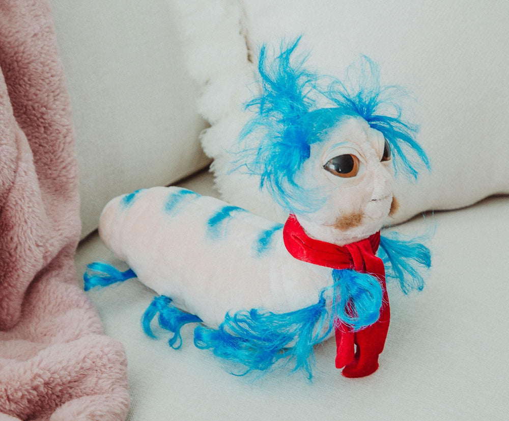 Toy Vault Worm Labyrinth plush in nap-time setup
